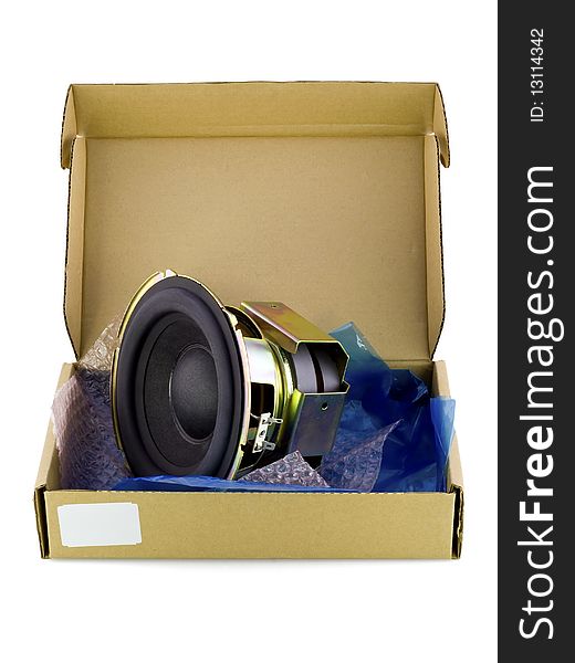 Real cardboard packing-box with electronic spare part- speaker woofer. Isolated on white. Mass production. Real cardboard packing-box with electronic spare part- speaker woofer. Isolated on white. Mass production.