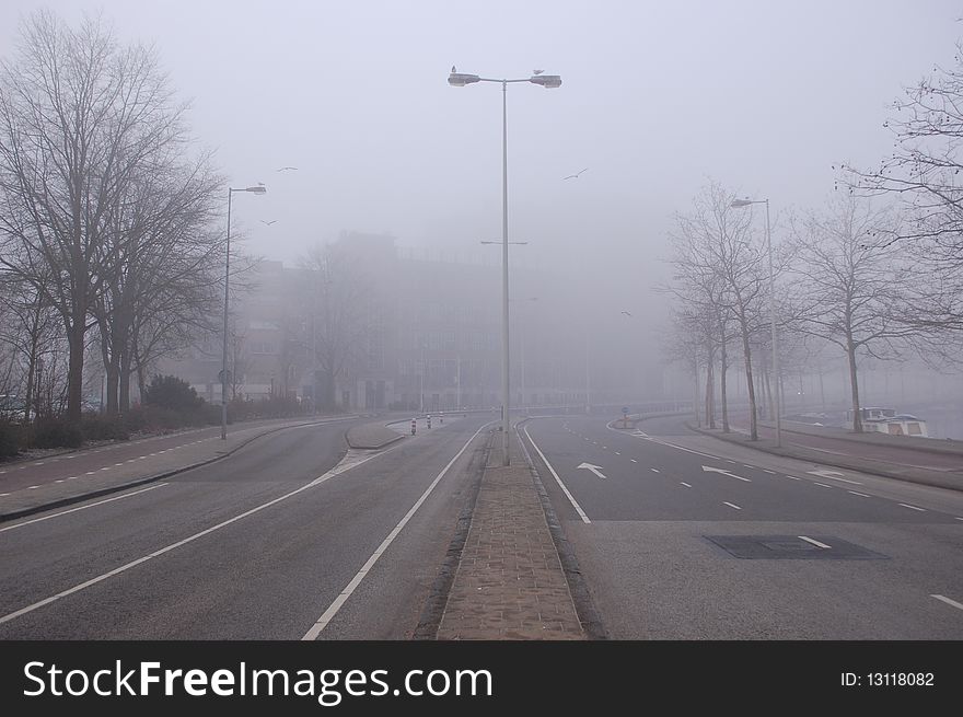 A traffic road in the fog in Amsterdam. A traffic road in the fog in Amsterdam