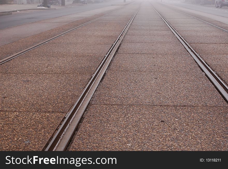 Railway tracks for a tram in Amsterdam on a misty morning