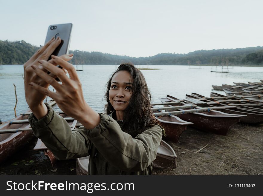 Woman Taking Selfie In Nature