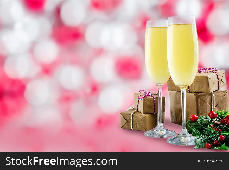 Champagne in in glasses with Christmas decoration on a shiny background. toning. selective focus