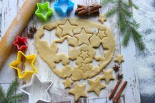 Baking Christmas Gingerbread, Flour Sprinkled Dough On A Wooden Table, Molds In The Form Of Stars Stock Image