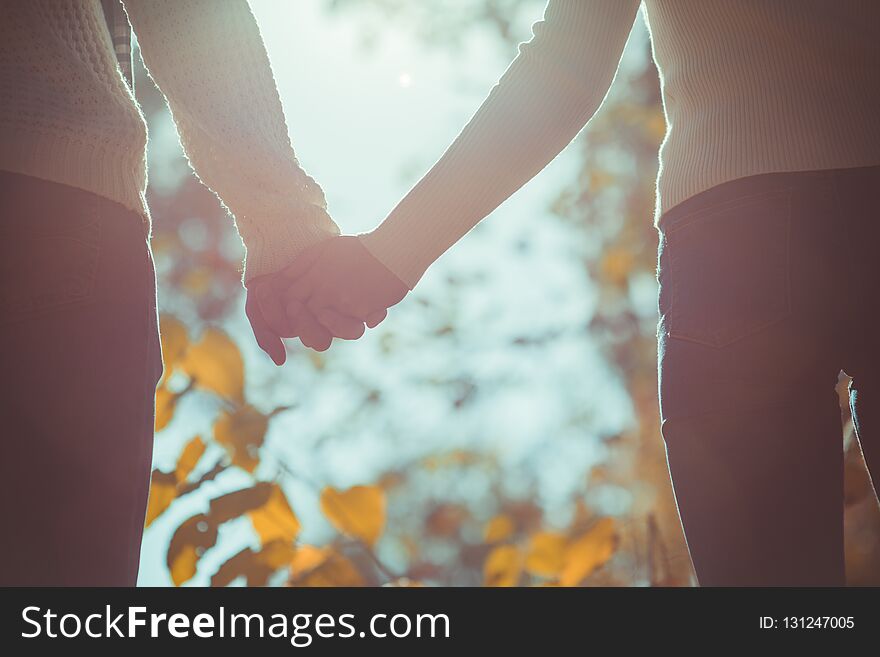 Young couple holding hands together