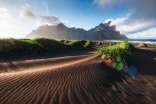 Fantastic West Of The Mountains And Volcanic Lava Sand Dunes On The Beach Stokksness, Iceland. Colorful Summer Morning Royalty Free Stock Images