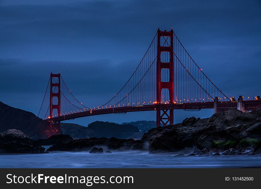View of Golden Gate Bridge at the blue hour from Baker Beach. View of Golden Gate Bridge at the blue hour from Baker Beach