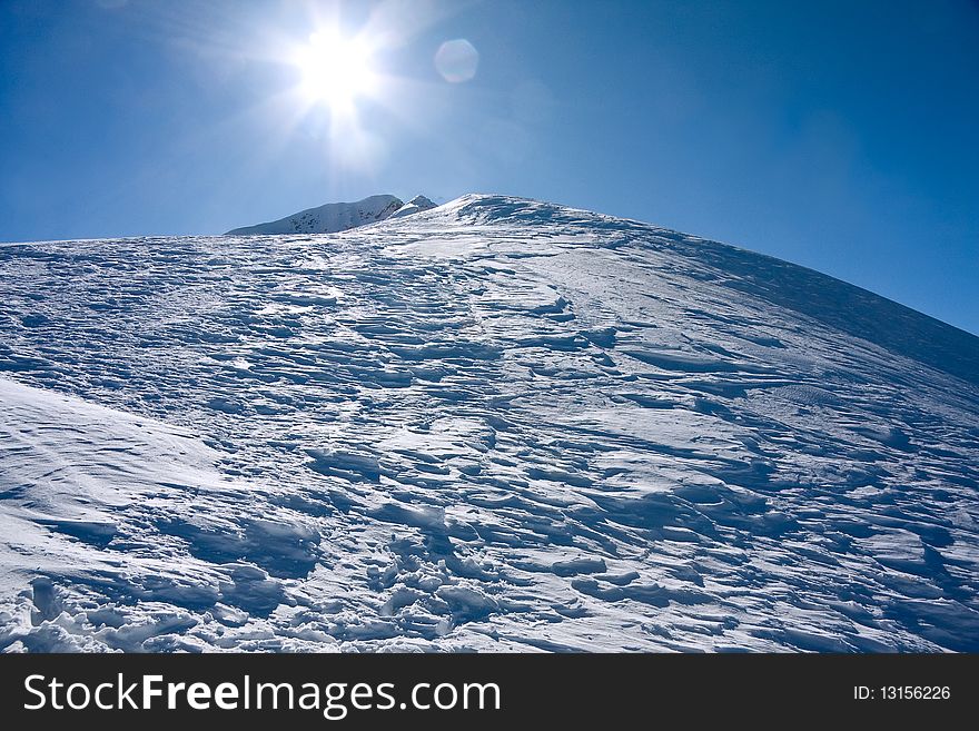Winter Mountains Landscape Against The Sun
