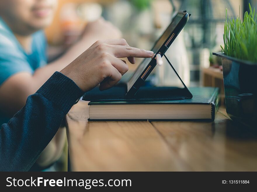 Young business man discuss with his friend about how to increasing sales and profitability effectively in coffee shop