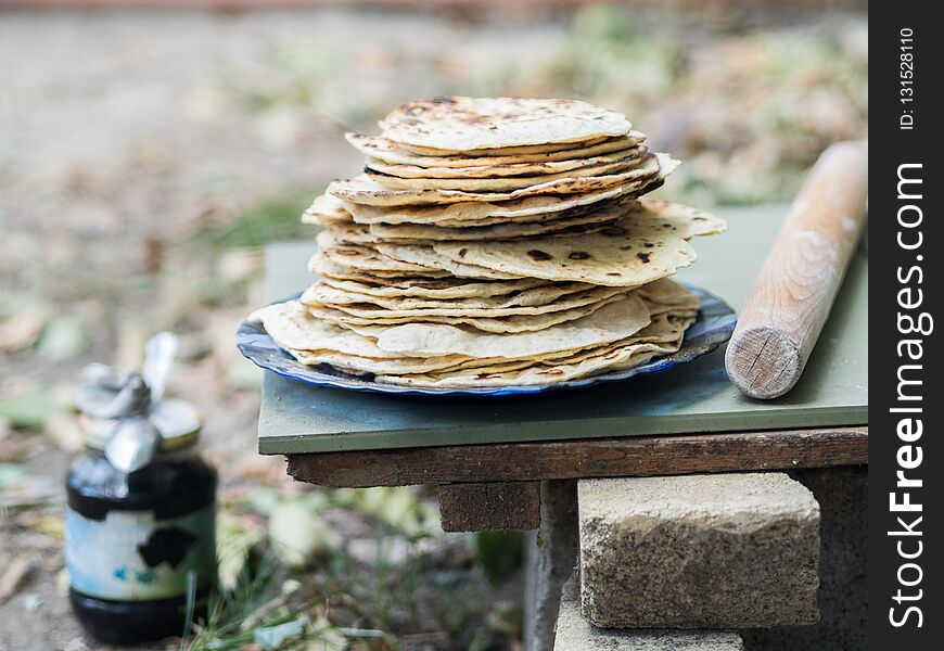 Chapati. Products made from flour. Cooked on water. On an open fire. With the addition of spices and salt. Unleavened cakes from d