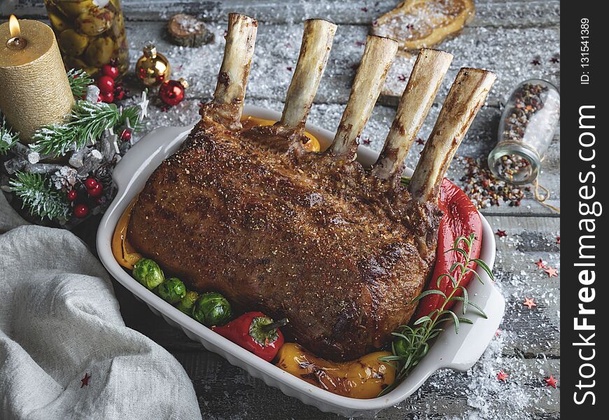 Grilled roasted rack of lamb,mutton with vegetables. New Year christmas composition,decoration.