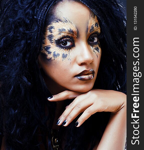 beauty afro girl with cat make up, creative leopard print closeu