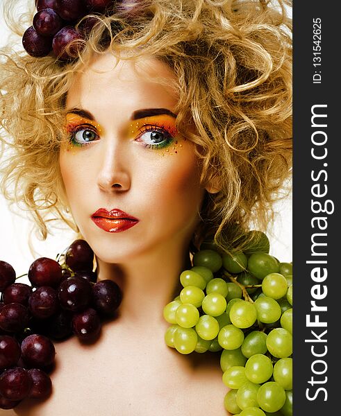 Beautiful young woman portrait excited smile with fantasy art hairstyle with grapes