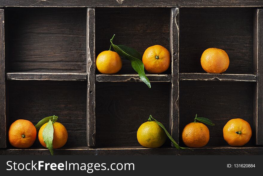 Fresh sweet mandarins on the wooden table, selective focus