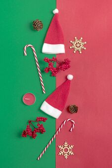 Christmas Composition. Christmas Decoration Gifts, , Santa Claus Hat , Candy, Snowflakes On Green, Red Background. Royalty Free Stock Image