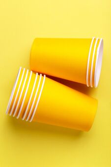Recycling Paper Cups For Drinks On Bright Yellow Background. Royalty Free Stock Photo Recycling Paper Cups For Drinks On Bright Yellow Background. Royalty Free Stock Photo