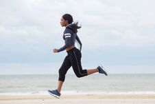Full Body Sporty Young Black Woman Running By The Beach Royalty Free Stock Images