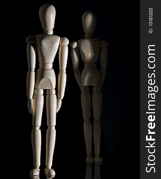 Wooden figure with a black back ground. Wooden figure with a black back ground