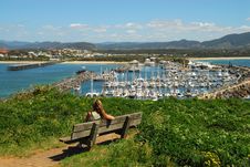Girl Sitting On A Bench Overlooking The Marina Royalty Free Stock Photos Girl Sitting On A Bench Overlooking The Marina Royalty Free Stock Photos