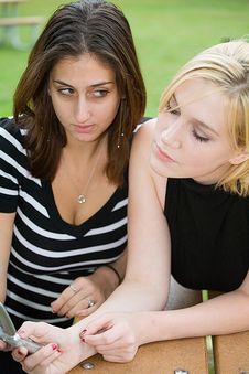 Friends On Cell Phone Together (Beautiful Young Blonde And Brune Stock Photo Friends On Cell Phone Together (Beautiful Young Blonde And Brune Stock Photo