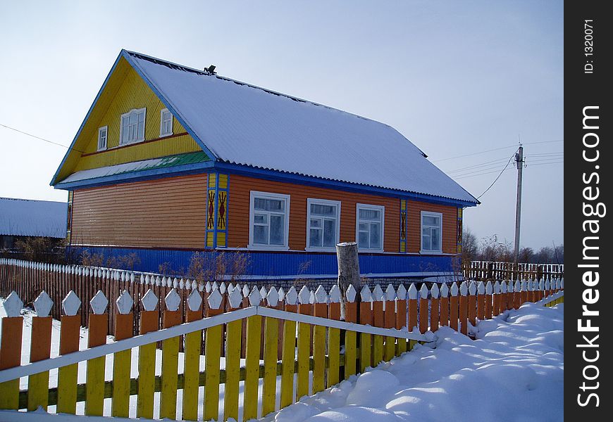 The rural house in a snow, winter, Russia