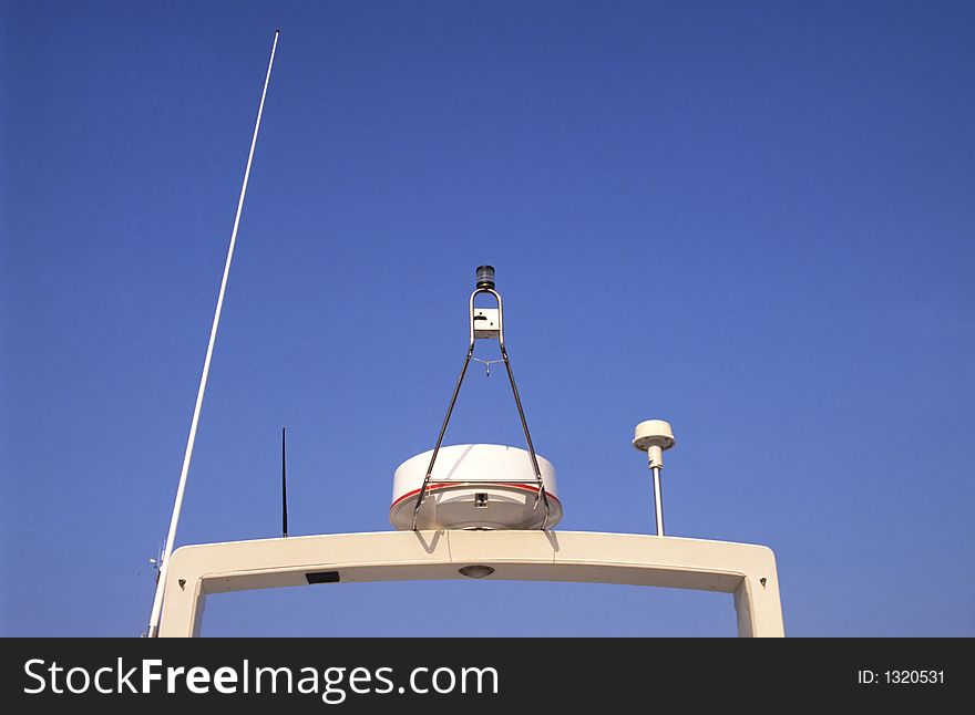 Top of a cruise ship showing radar, alarms and antenna. Top of a cruise ship showing radar, alarms and antenna.