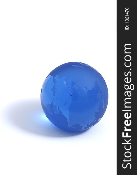Blue glass globe paperweight isolation showing Asia. Blue glass globe paperweight isolation showing Asia