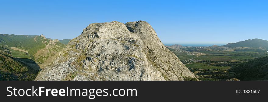 Rock, ridges and sea (panorama from 9 frames)