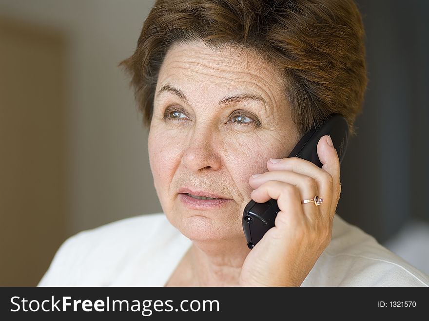 Businesswoman in the office on a phone