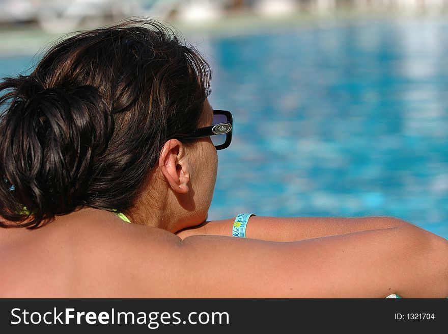 Young women relaxing on the pool