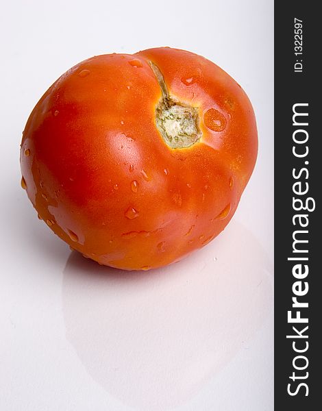A tomato against a white background.