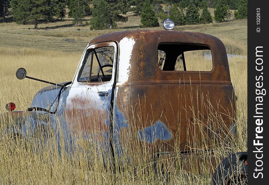 This image of the old rusted out truck abandoned in the field was taken in NW Montana. This image of the old rusted out truck abandoned in the field was taken in NW Montana.