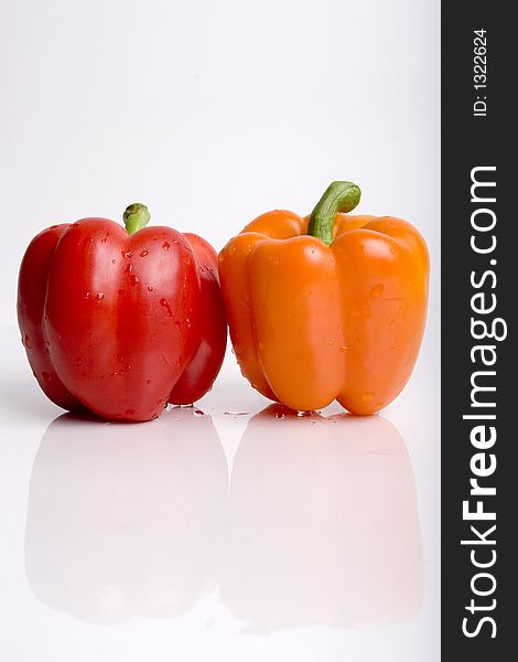 Red and orange pepper together. Red and orange pepper together