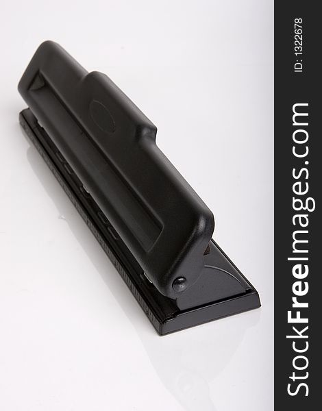 Office hole puncher Isolated its black. Office hole puncher Isolated its black