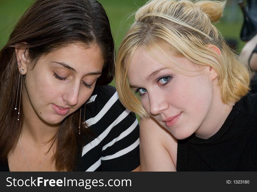 Friends on Cell Phone together (Beautiful Young Blonde and Brune