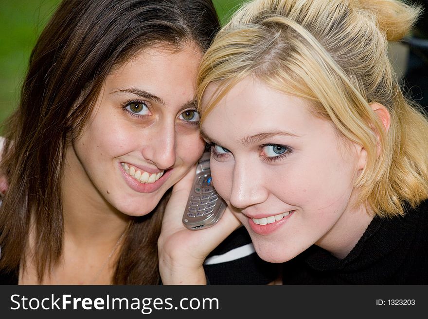 Friends on Cell Phone together (Beautiful Young Blonde and Brune