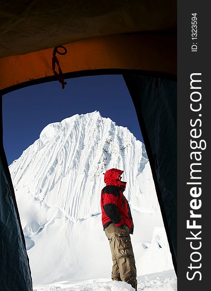 Climber on bakcground Alpamayo peak. Climber on bakcground Alpamayo peak