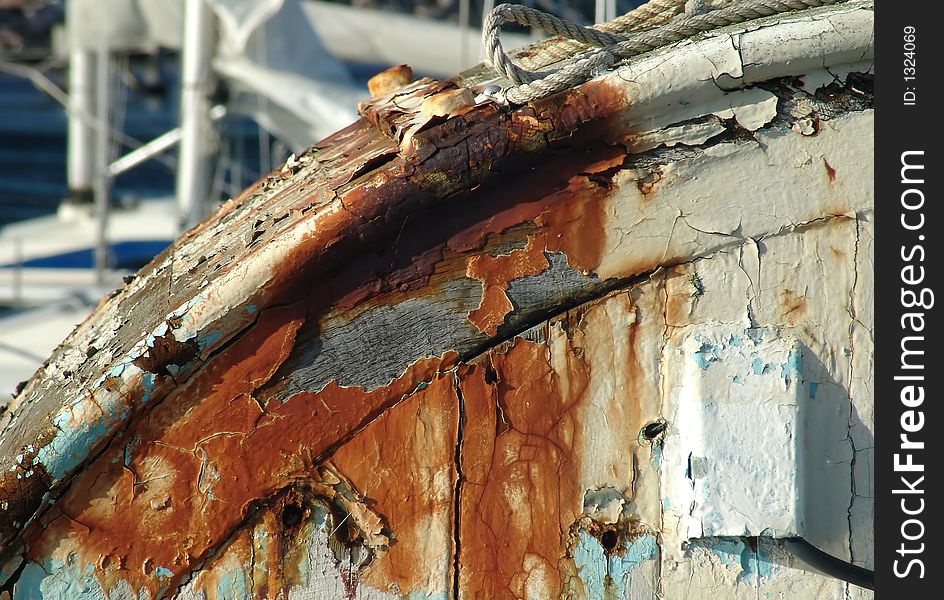 The finish of a boat flaking away. The finish of a boat flaking away