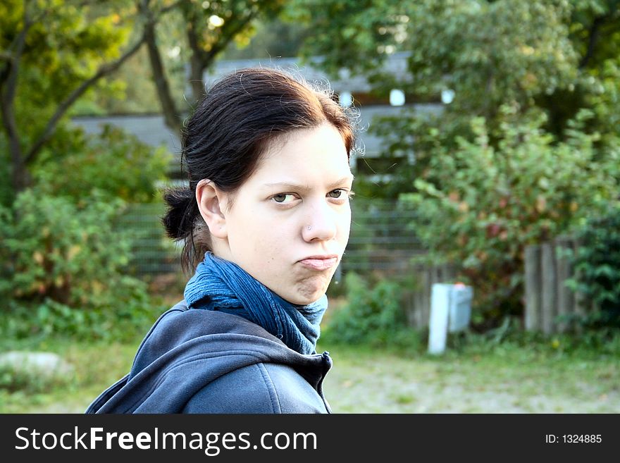 Young woman with grimace