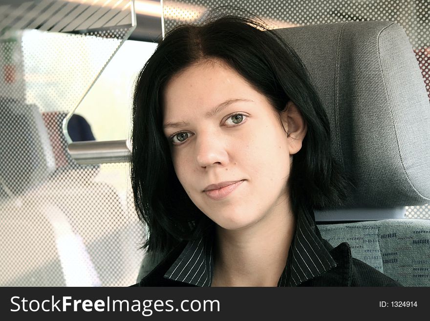 Young woman sitting in the train 3