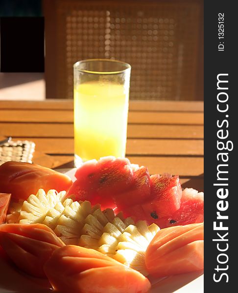 Glass of orange juice and fresh fruits. Glass of orange juice and fresh fruits
