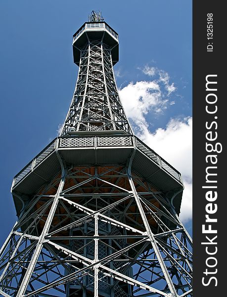 A steel tower with sky as background