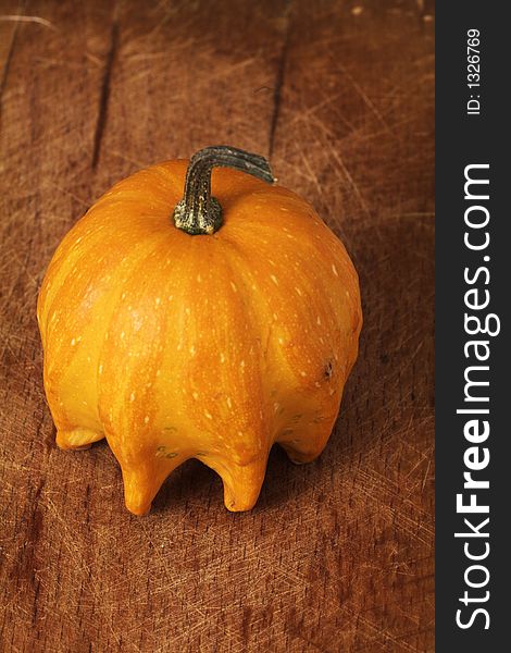 Decorative pumpkin on wooden table