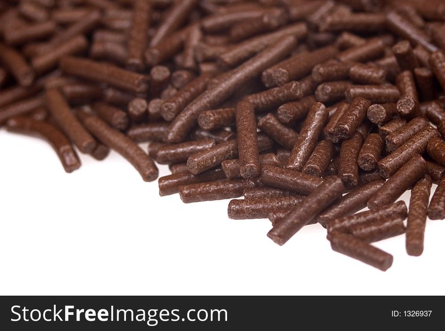 Chocolate sprinkles on white background