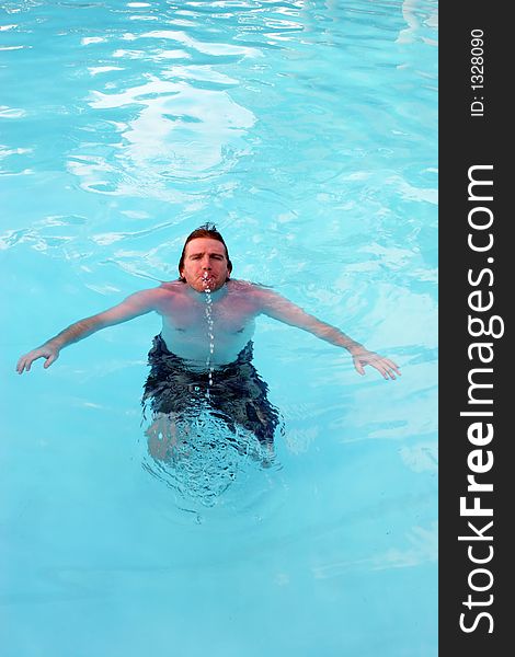 Man in a swimming pool. Man in a swimming pool