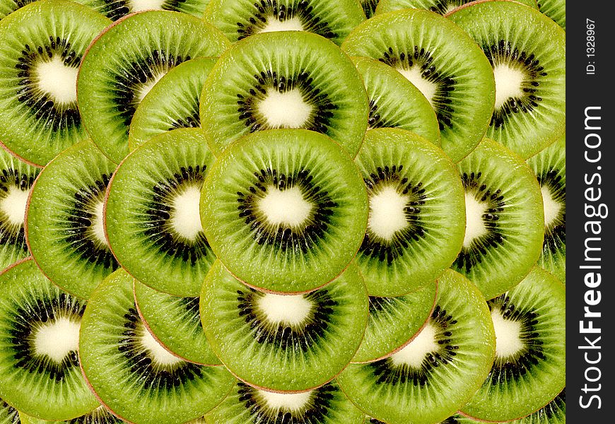 Fresh kiwi slices as a background. Fresh kiwi slices as a background
