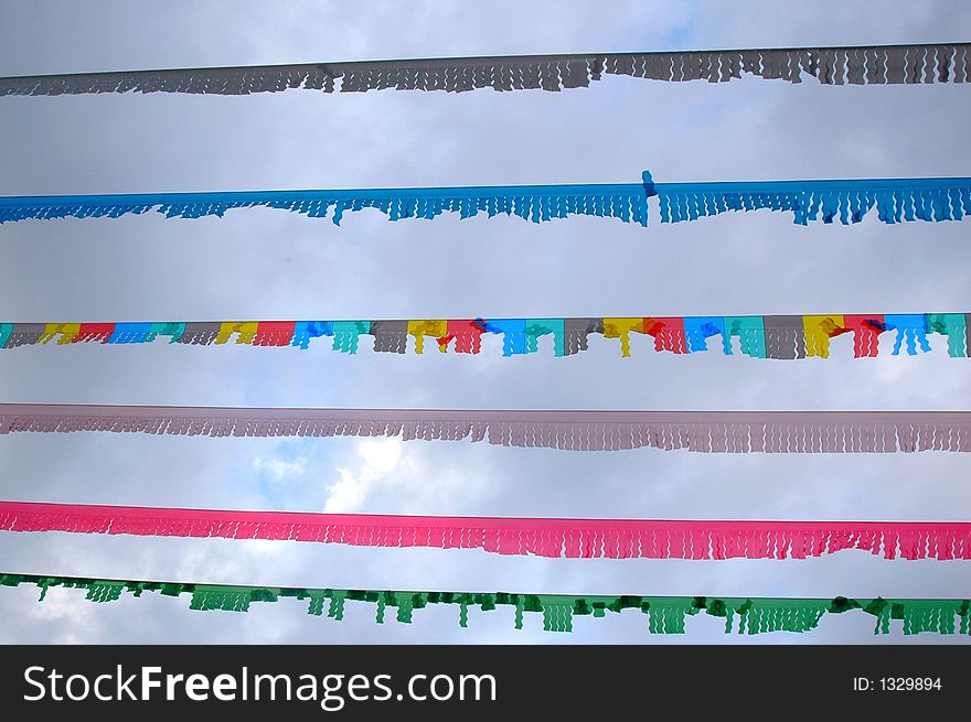 Colourful flaglines against cloudy sky. Colourful flaglines against cloudy sky