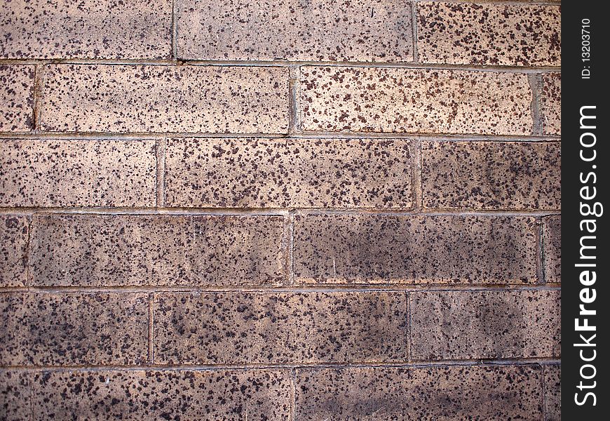 Brown brickwall background detail close-up