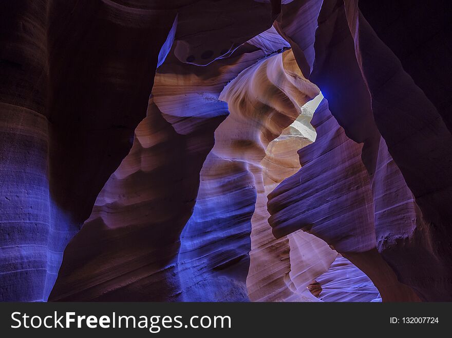 Colorful curved blue and purple walls in Lower Antelope Canyon in the Navajo Reservation near Page, Arizona, USA. Colorful curved blue and purple walls in Lower Antelope Canyon in the Navajo Reservation near Page, Arizona, USA.