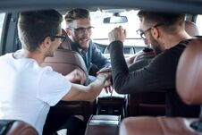 Close Up. A Group Of Friends Greets Each Other In The Car Stock Image