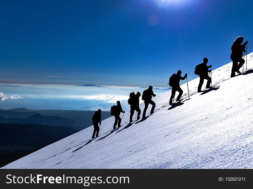 Athletes walking on the snow ;mountain range. Athletes walking on the snow ;mountain range