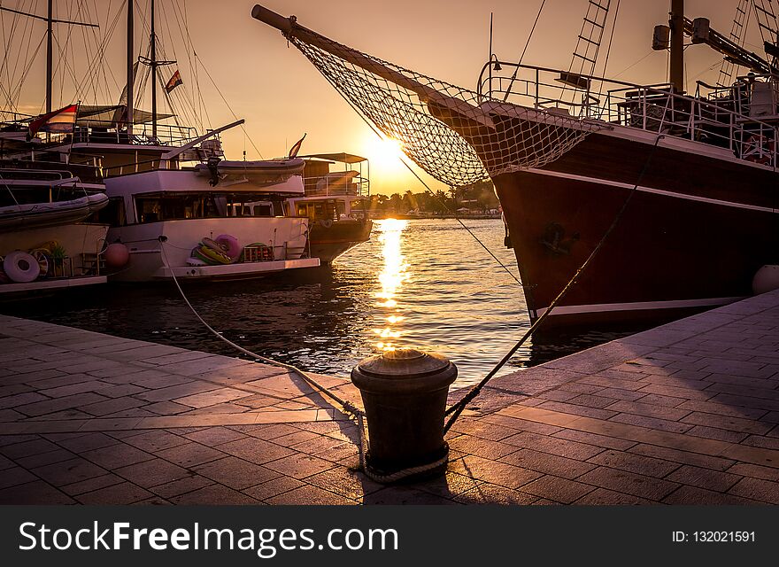 Golden sunset in dalmatian Makarska harbour in Croatia. Golden sunset in dalmatian Makarska harbour in Croatia